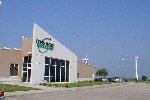 Consumers Energy headquarters near Marshalltown, Iowa with a wind turbine in the background