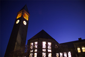Clocktower at dusk with Uris library