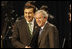 President George W. Bush and President Mikheil Saakashvili of Georgia, shake hands as they smile at cameras before the start of the afternoon session of the 2008 NATO Summit in Bucharest.