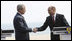 President George W. Bush and President Taian Basescu of Romania, shake hands after concluding their joint press availability Wednesday, April 2, 2008, at the presidential retreat in Neptun, Romania.