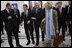 President George W. Bush embraces President Nicolas Sarkozy of France, as they arrive for a session of the NATO Summit Thursday, April 3, 2008, in Bucharest.