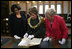 Mrs. Laura Bush is shown a rare book during her visit Saturday, April 5, 2008, to the Croatian State Archives in Zagreb.