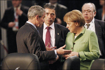 President George W. Bush joins Danish Prime Minister Anders Fogh Ransmussen and German Chancellor Angela Merkel Thursday, April 3, 2008, prior to the start of the afternoon's NATO Summit Meeting on Afghanistan in Bucharest.