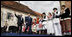 President George W. Bush waves as he arrives on stage with Prime Minister Ivo Sanader of Croatia, Saturday, April 5, 2008, at St. Mark's Square in Zagreb. Thousands of people turned out in the square to hear President Bush tell them, "Croatia is a very different place than it was just a decade ago. The Croatian people have overcome war and hardship to build peaceful relations with your neighbors, and to build a muturing democracy in one of the most beautiful countries ono the face of the Earth."