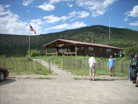 Author's family members in front of ranger station;mountains in background