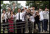 Crowds wave as the motorcade of the Mrs. Laura Bush travels to the Lake Toya Visitors Center Wednesday, July 9, 2008, in Hokkaido, Japan.