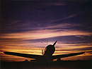 Military Airplane on the Tarmac at Sunset