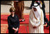 Mrs. Laura Bush and President Bush are greeted by Saudi delegation members during arrival ceremonies Friday, May 16, 2008, at Riyadh-King Khaled International Airport in Riyadh.