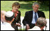 President George W. Bush and Mrs. Laura Bush listen to as a young participant during a roundtable discussion Friday, May 16, 2008, at the Bible Lands Museum Jerusalem. On the topic of peace with the Palestinians, the young student said, "I'm religious, but I want to give the Arabs land," he said. "I feel I have a good life. Why don't they get a good life too?"