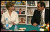 Mrs. Laura Bush smiles as she participates in a Big Read Egypt/U.S. roundtable discussion Sunday, May 18, 2008, with students at the Fayrouz Experimental School for Languages at Sharm El Sheikh. Mrs. Bush told the participants that the Big Read partnership will use literature to enhance understanding of each other's societies and will also awaken the joy of reading in both Egyptians and Americans, particularly young people. Sitting with her is Dr. Yousry Saber Hussein El-Gamal, Minister of Education.