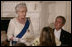 President George W. Bush listens as Her Majesty Queen Elizabeth II reads a statement Monday, May 7, 2007, during the State Dinner in her honor at the White House. White House photo by Shealah Craighead