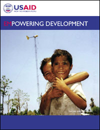 Thumbnail image of the Empowering Development publication. The large photo on the cover shows two boys hugging with a windmill in the background. Click on the thumbnail image to open the publication as a PDF file.