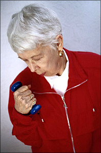 photo of a woman lifting weight