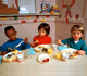 Three Young Boys Eating