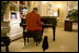 India listens attentively to a piano serenade in the Private Residence of the White House in this 2007 photograph. The 18-year-old Bush family pet died Sunday, January 4, 2009, at home in the White House. White House photo by Paul Morse