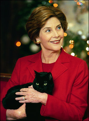 Mrs. Laura Bush holds India, the First Kitty, during a 2004 taping of Barney Cam at the White House. Affectionately known as Kitty by the family, the 18-year-old American Shorthair died Sunday, January 4, 2009, at home in the White House. White House photo by Susan Sterner