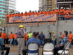 Neil speaks to a group of construction workers about the importance of getting out to vote