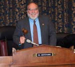 Congressman Abercrombie holding a gavel.