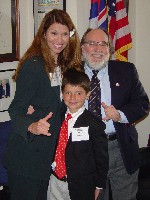 Congressman Neil Abercrombie visits with Dr. Suzanne Yandow of Shriners Hospital for Children and son Garrett Shomaker to discuss research funding for Musculoskeletal Diseases in the NIH FY05 budget.