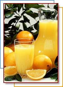 Photo of oranges and pitcher of juice