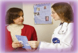 Woman talking to doctor