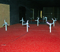 Photo showing model windmills in the tunnel that replicate the arrangement in a typical wind farm.