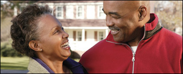 Photo: Smiling man and woman.