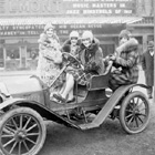 Women sitting in a car in front of the Belmont Theater