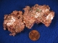 This image shows copper in ore and a penny.