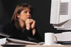 Worried Woman at Desk