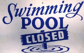 A sign saying "Swimming Pool Closed"