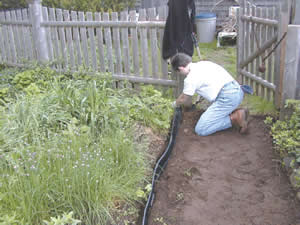 man installing garden walkway