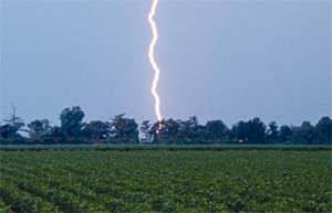 photo: lightning striking across a field