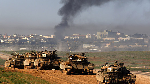 A convoy of Israeli tanks moves towards the Gaza border.