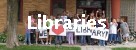Libraries-Children in front of a library holding up signs 'We Love Our Library.'