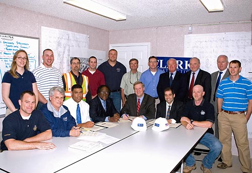 Assistant Secretary Edwin G. Foulke, Jr., USDOL-OSHA, and the partnership signatories are joined by Clark Construction LLC workers after the partnership signing ceremony