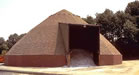 photo of road salt storage facility showing wide, weatherproof roof.