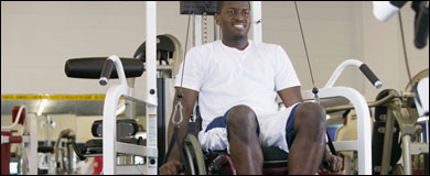 Photo: A man in a wheelchair exercising