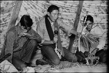 Crow youth wearing prayer shawl, Crow Indian Researvation, Montana, 1957