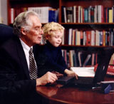 Color photo of Dr. Donald A.B. Lindberg and grandson at computer