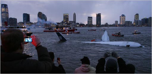 Bystanders watched as a US Airways plane drifted after ditching into the Hudson River on Thursday.