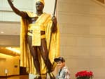 Nainoa Fukimora stands by King Kamehameha in the New Capitol Visitor's Center in December 2008.