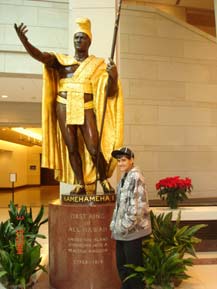 Nainoa Fukimora stands by King Kamehameha in the New Capitol Visitor's Center in December 2008