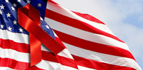 Image of American flag with red-ribbon on top.