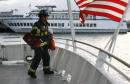 <p>A firefighter waits on the deck of a rescue boat as it heads out to a U.S. Airways plane that crashed into the Hudson River in New York, January 15, 2009.     REUTERS/Eric Thayer (UNITED STATES)</p>