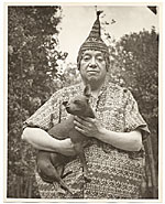 [Diego Rivera holding a Dog]