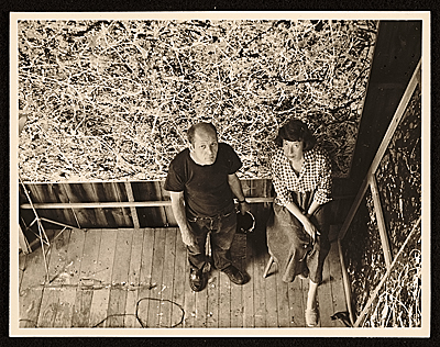 [Jackson Pollock and Lee Krasner in Pollock's studio, looking up at the camera]
