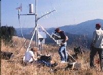 Photo of technicians with Remote Automated Weather Station