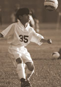 young boy playing soccer