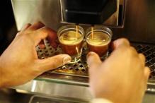 A barista makes espresso during training at Starbucks in New York, February 26, 2008.